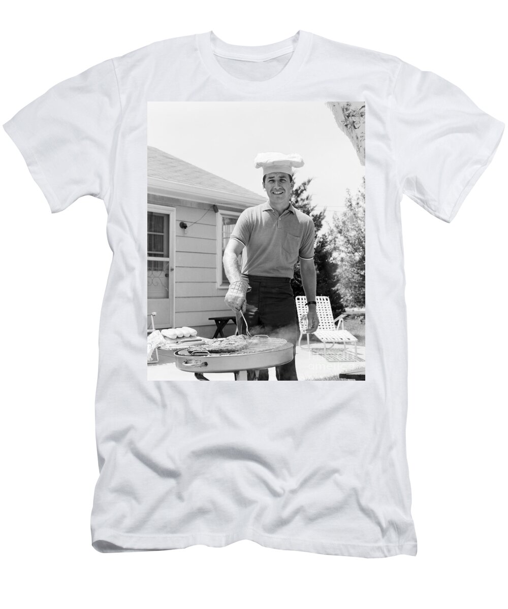 1960s T-Shirt featuring the photograph Man Cooking Out, C.1960s by H. Armstrong Roberts/ClassicStock
