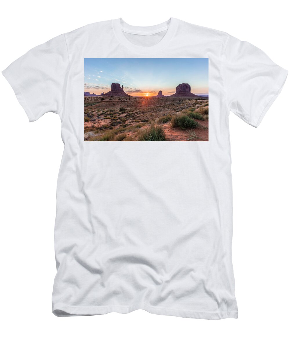 American Landscape T-Shirt featuring the photograph Monument Valley Sunrise peaking through by John McGraw