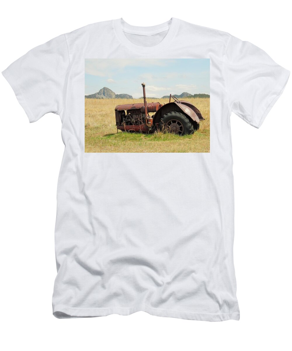 Wyoming T-Shirt featuring the photograph Old tractor with little Missouri Buttes by Pamela Pursel