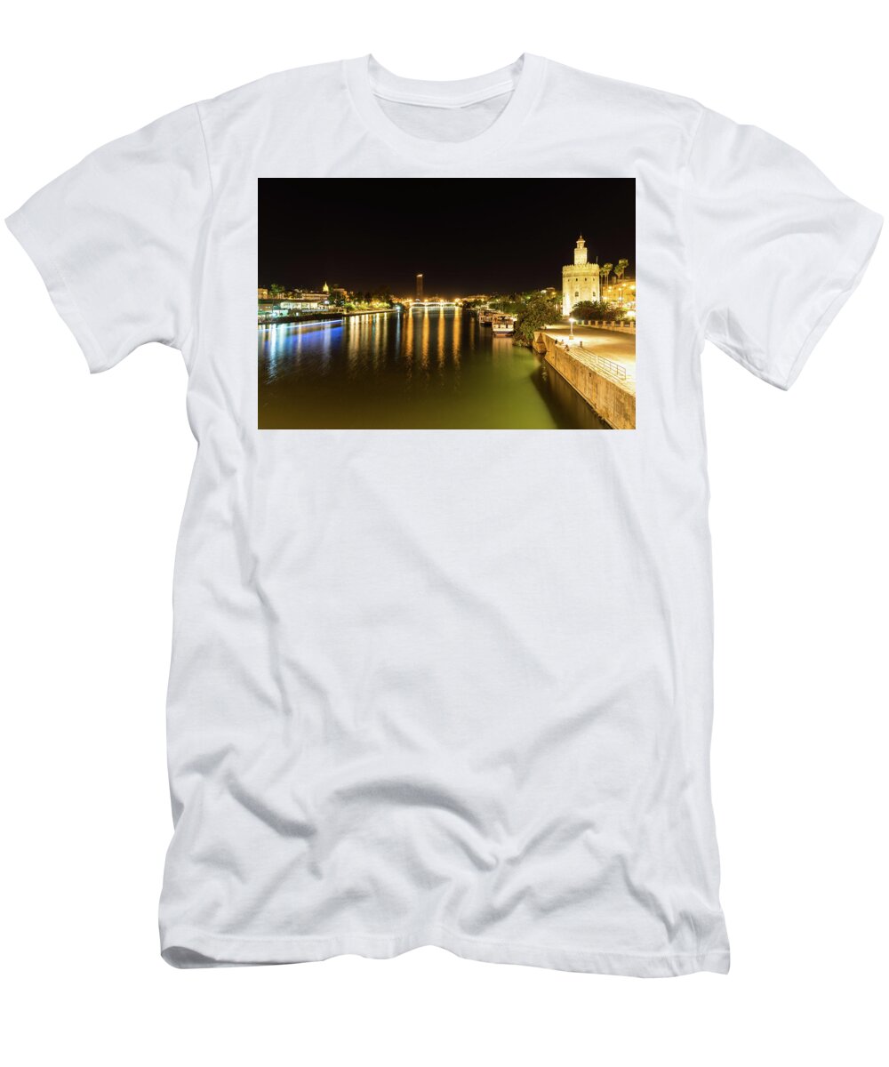 Torre Del Oro T-Shirt featuring the photograph Seville Night Magic - Torre del Oro and Guadalquivir River in Bright Gold by Georgia Mizuleva