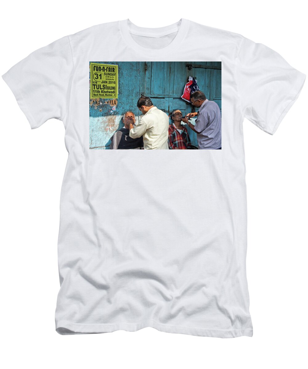 Street Side Barbershop In The Back Streets Of Mumbai. T-Shirt featuring the photograph Snip and tuck by Marion Galt