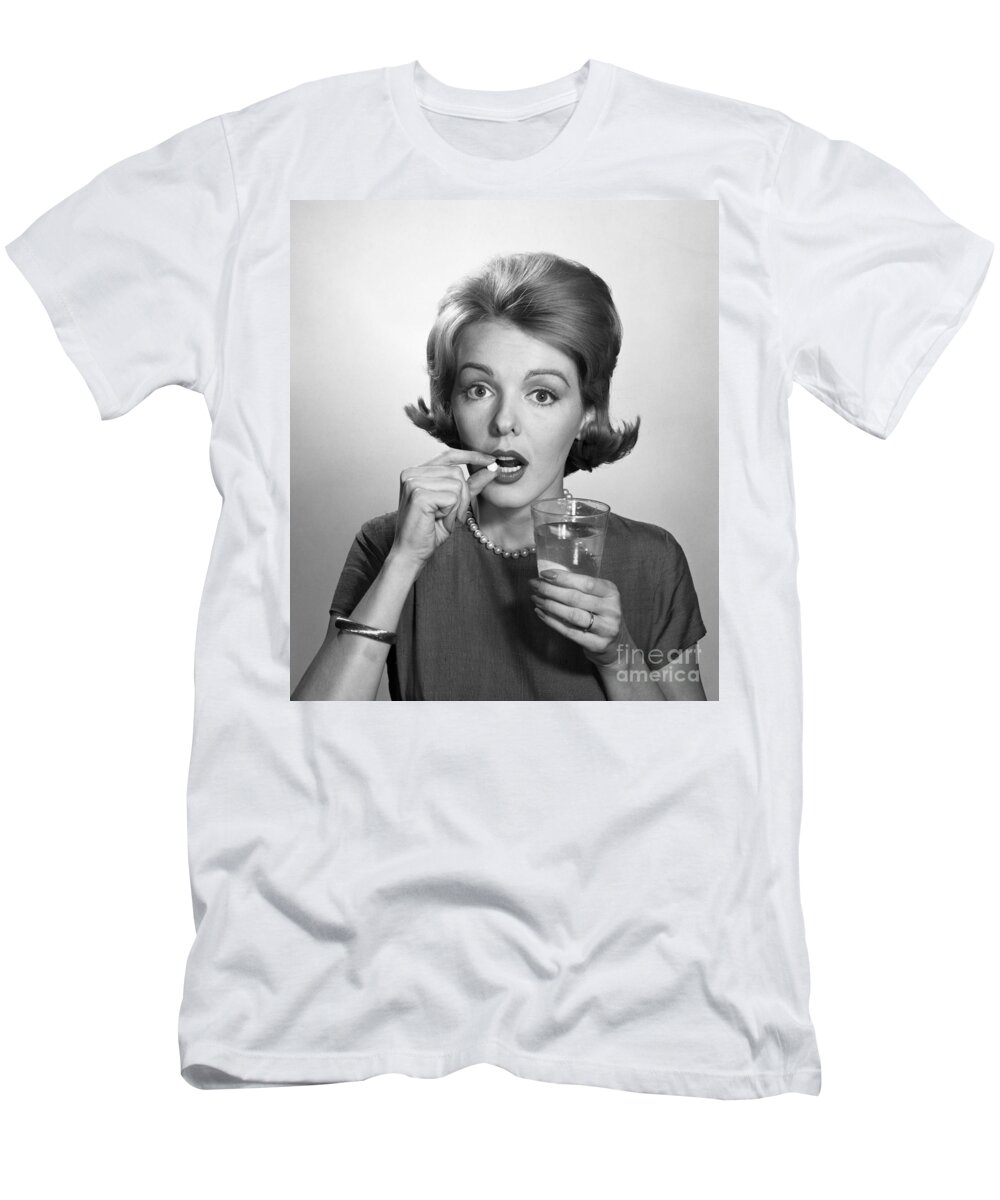 1960s T-Shirt featuring the photograph Woman Taking An Aspirin Pill by Debrocke/ClassicStock