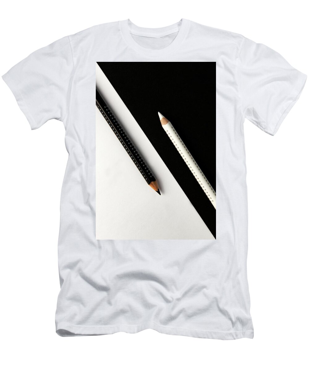 Pencil T-Shirt featuring the photograph Two drawing pencils on a black and white surface. by Michalakis Ppalis