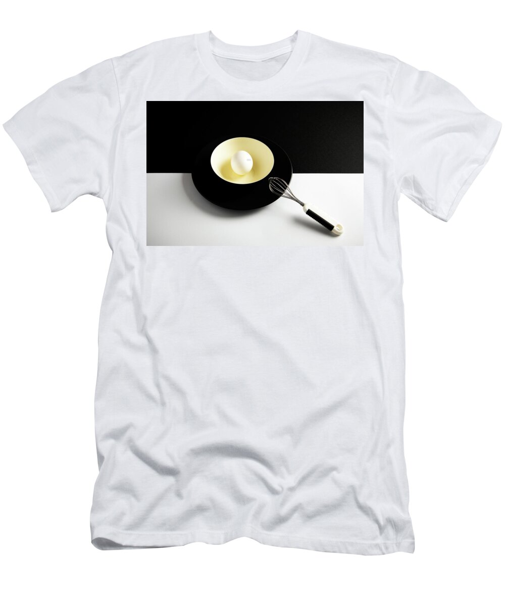 Egg T-Shirt featuring the photograph White egg on a yellow bowl. by Michalakis Ppalis