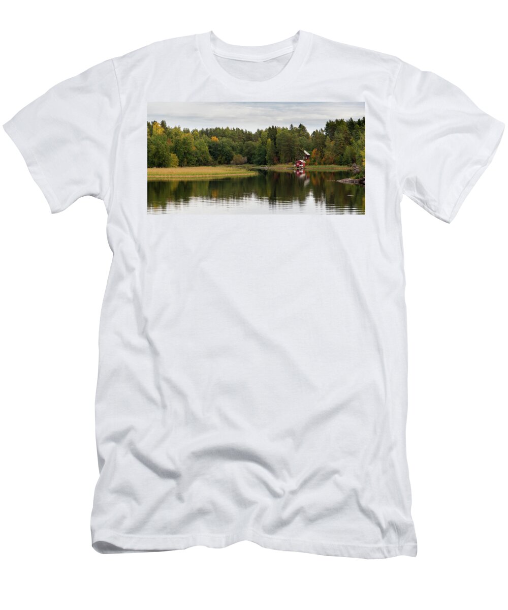 Kuopio T-Shirt featuring the photograph Country house in the forest in the lake. Autumn season Kuopio Finland #1 by Michalakis Ppalis