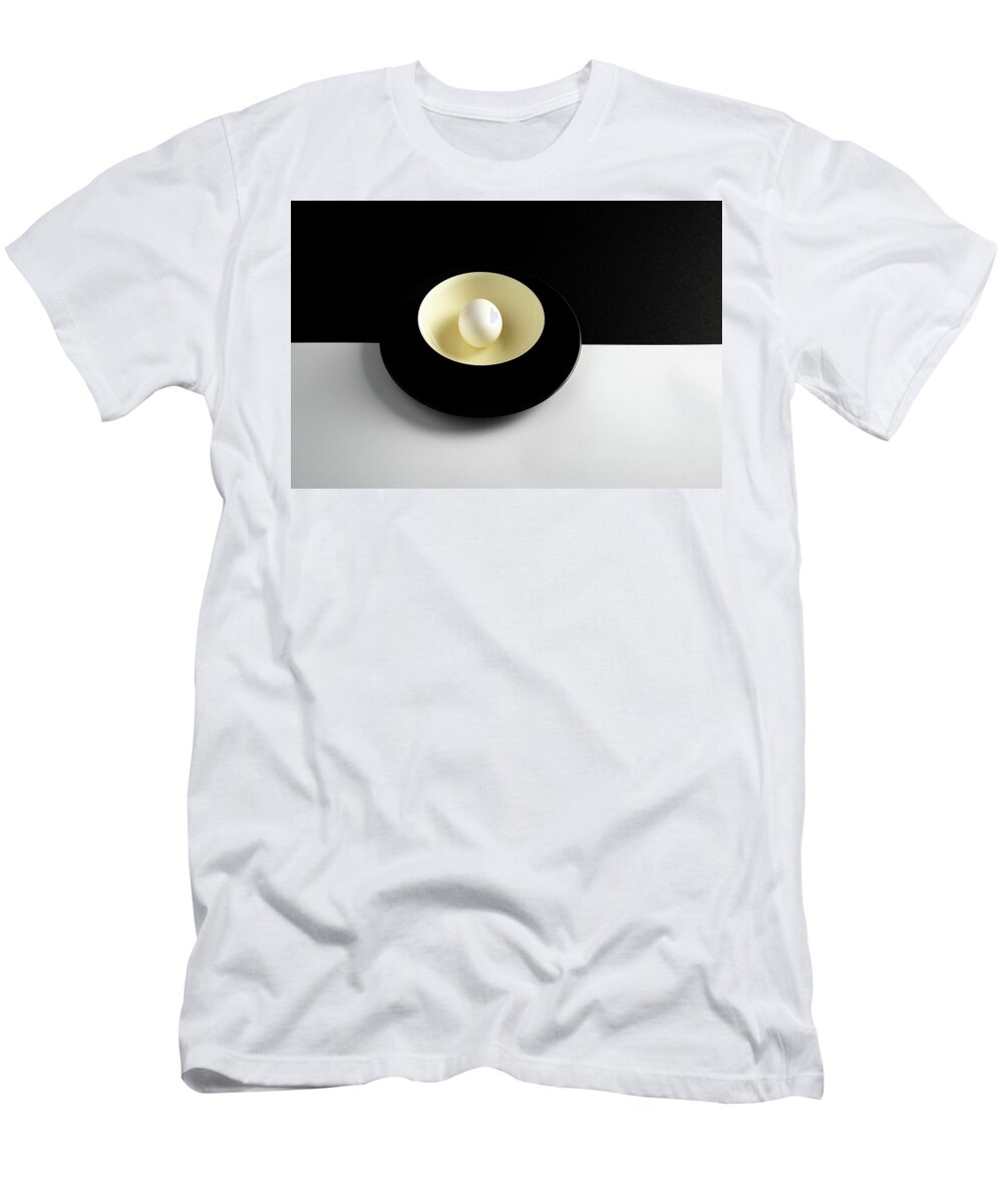 Still-life T-Shirt featuring the photograph Single fresh white egg on a yellow bowl by Michalakis Ppalis