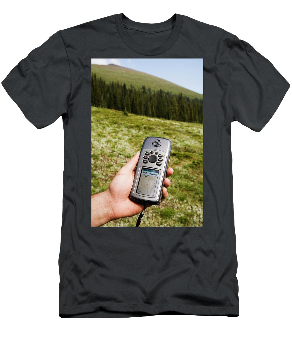 Adult T-Shirt featuring the photograph A Man Checks His Location On His Gps #1 by Dan Shugar