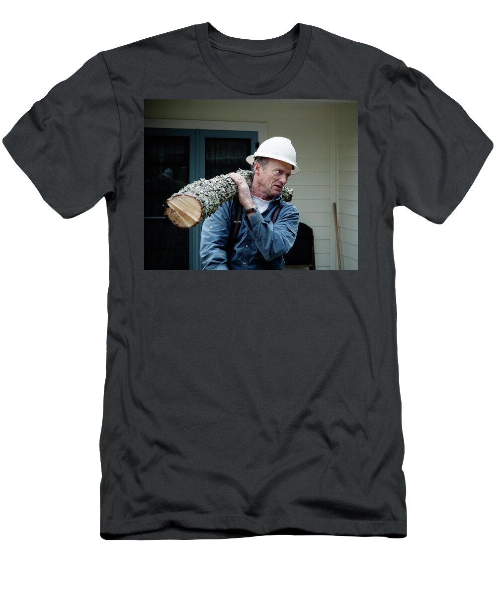 45-49 Years T-Shirt featuring the photograph A Man Wearing A Hard Hat Carries by Ron Koeberer