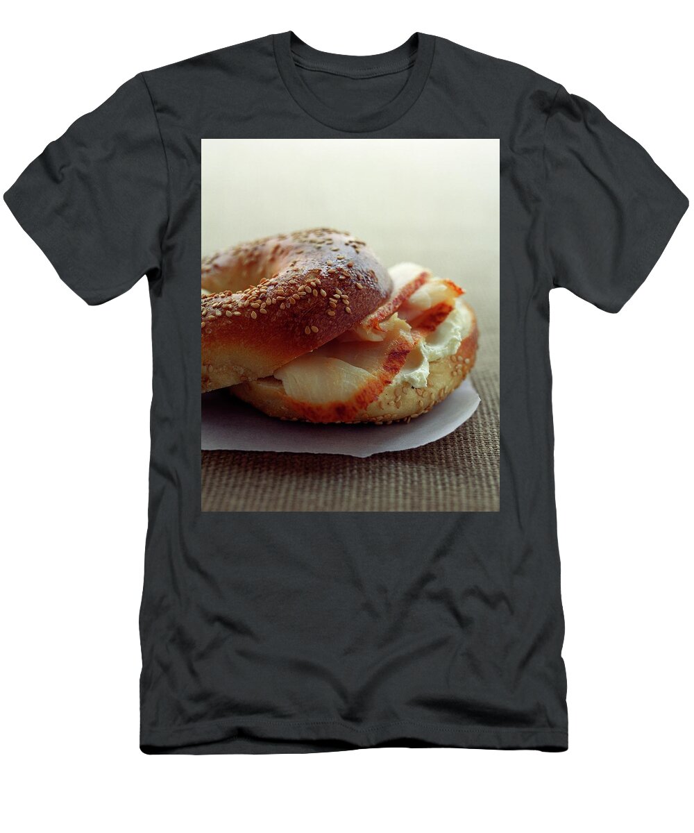 Still Life T-Shirt featuring the photograph A Sesame Bagel by Romulo Yanes