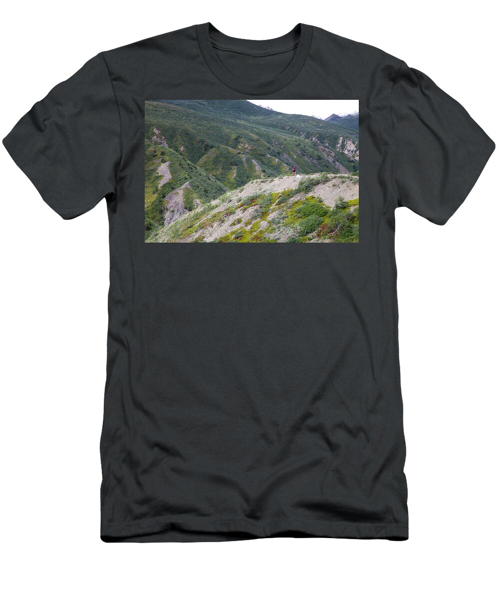 Distant T-Shirt featuring the photograph A Woman Takes A Trail Run In Kluane by Robin Carleton