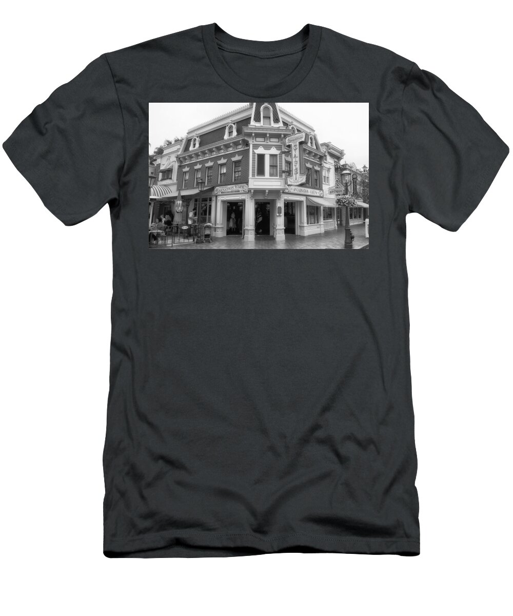 Main Street T-Shirt featuring the photograph Carnation Cafe Main Street Disneyland BW by Thomas Woolworth