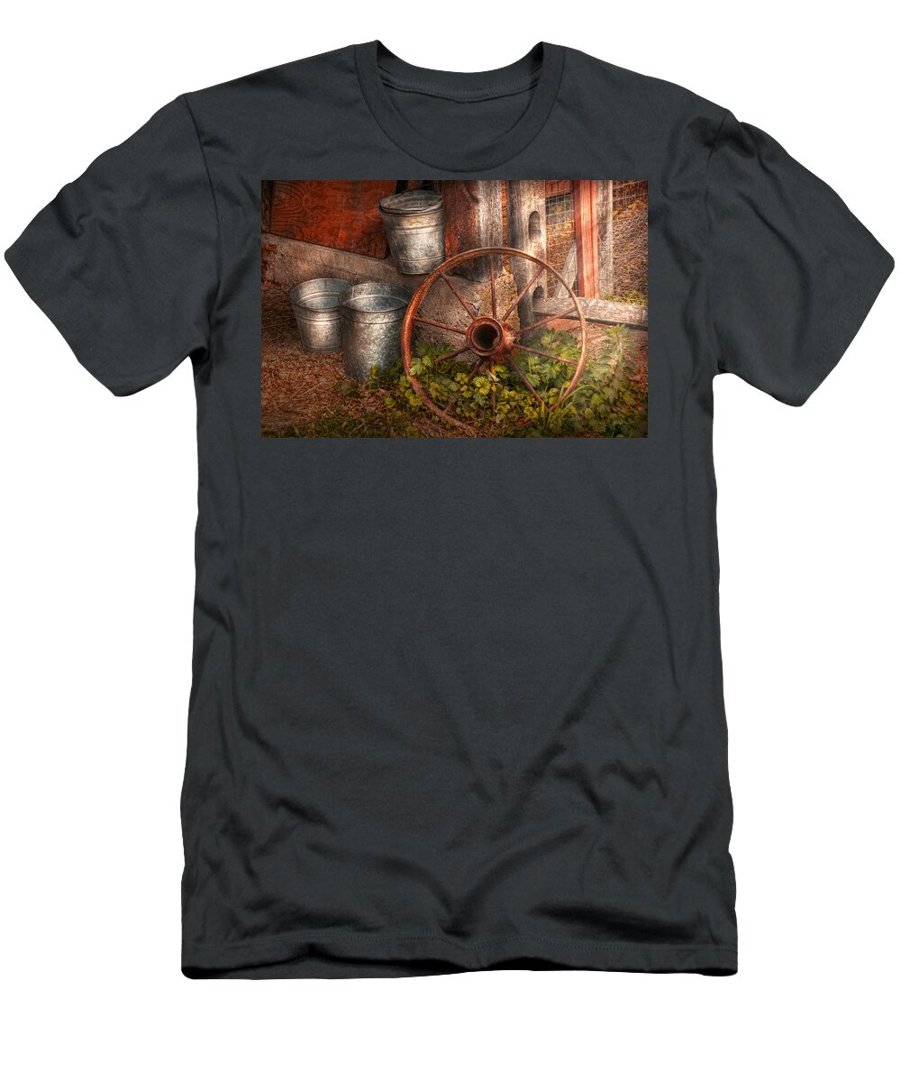 Country T-Shirt featuring the photograph Country - Some dented pails and an old wheel by Mike Savad