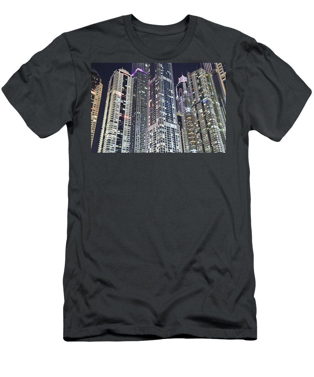 Outdoors T-Shirt featuring the photograph Skyscrapers Illuminated At Nighttime by Alexander Macfarlane