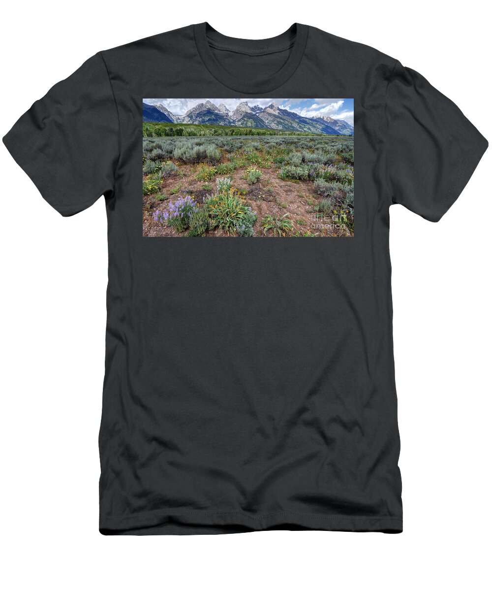 Grand Teton T-Shirt featuring the photograph Wildflowers Bloom Below Teton Mountain Range by Gary Whitton