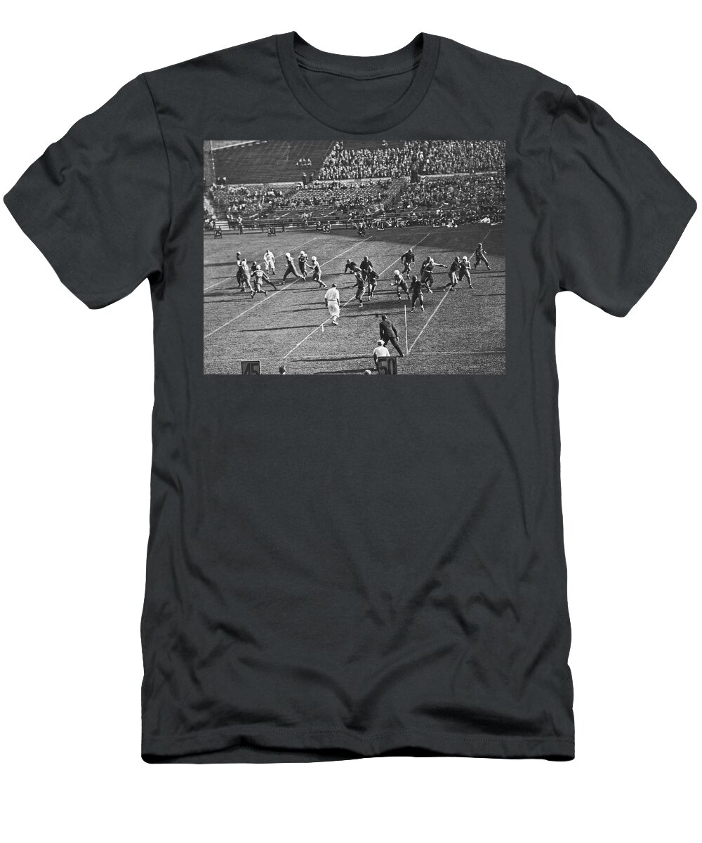 1910s T-Shirt featuring the photograph Quarterback Throwing Football #1 by Underwood Archives