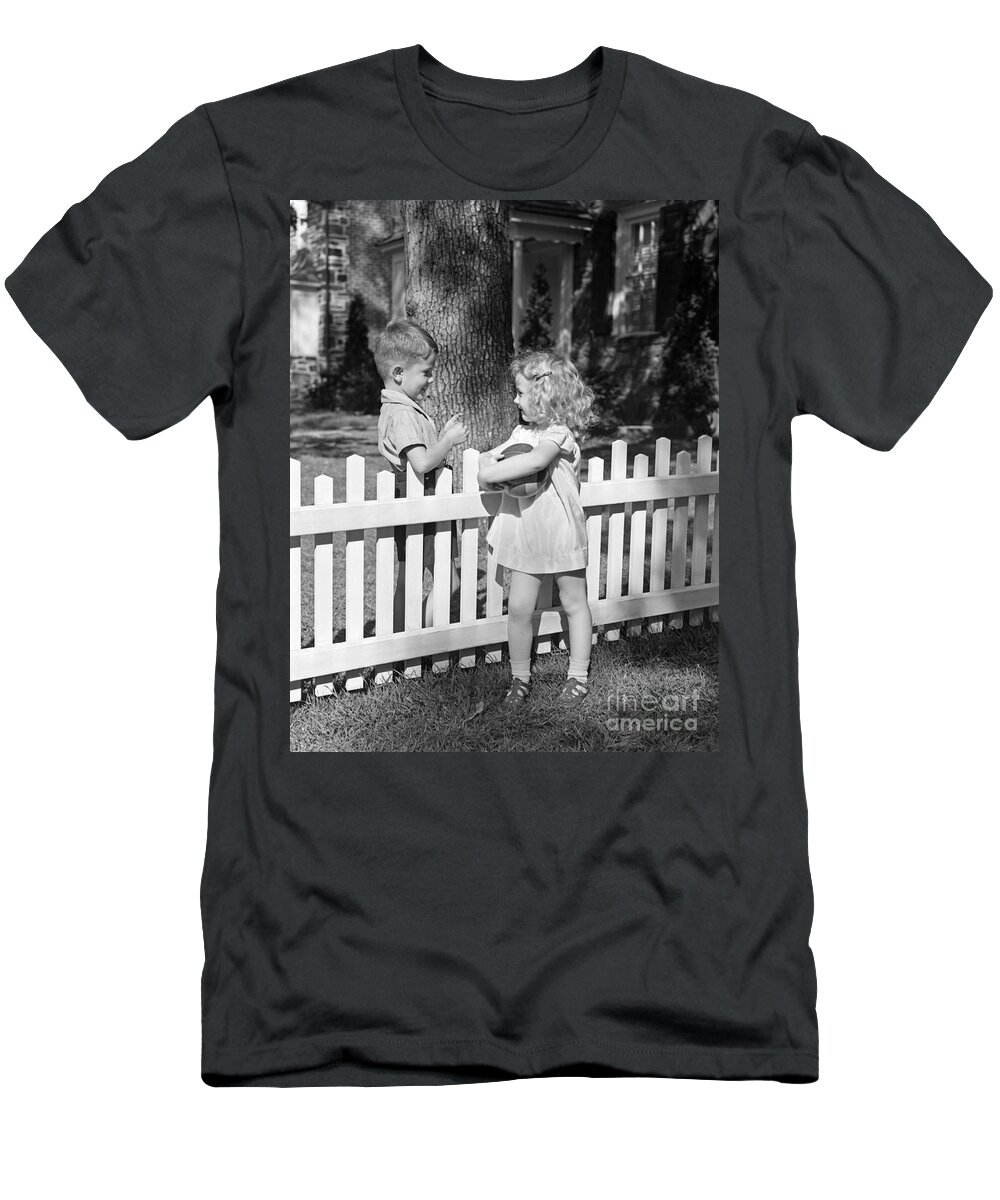 1940s T-Shirt featuring the photograph Boy And Girl Talking Over Fence, C.1940s by H. Armstrong Roberts/ClassicStock
