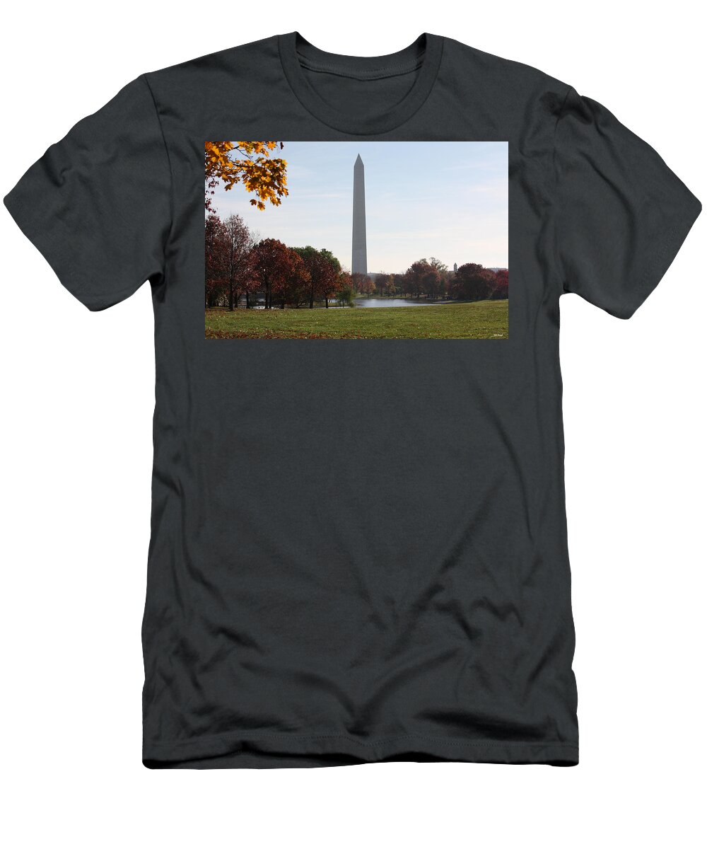 Capital T-Shirt featuring the photograph Capital Autumns - The Washington Monument - under the Trees by Ronald Reid
