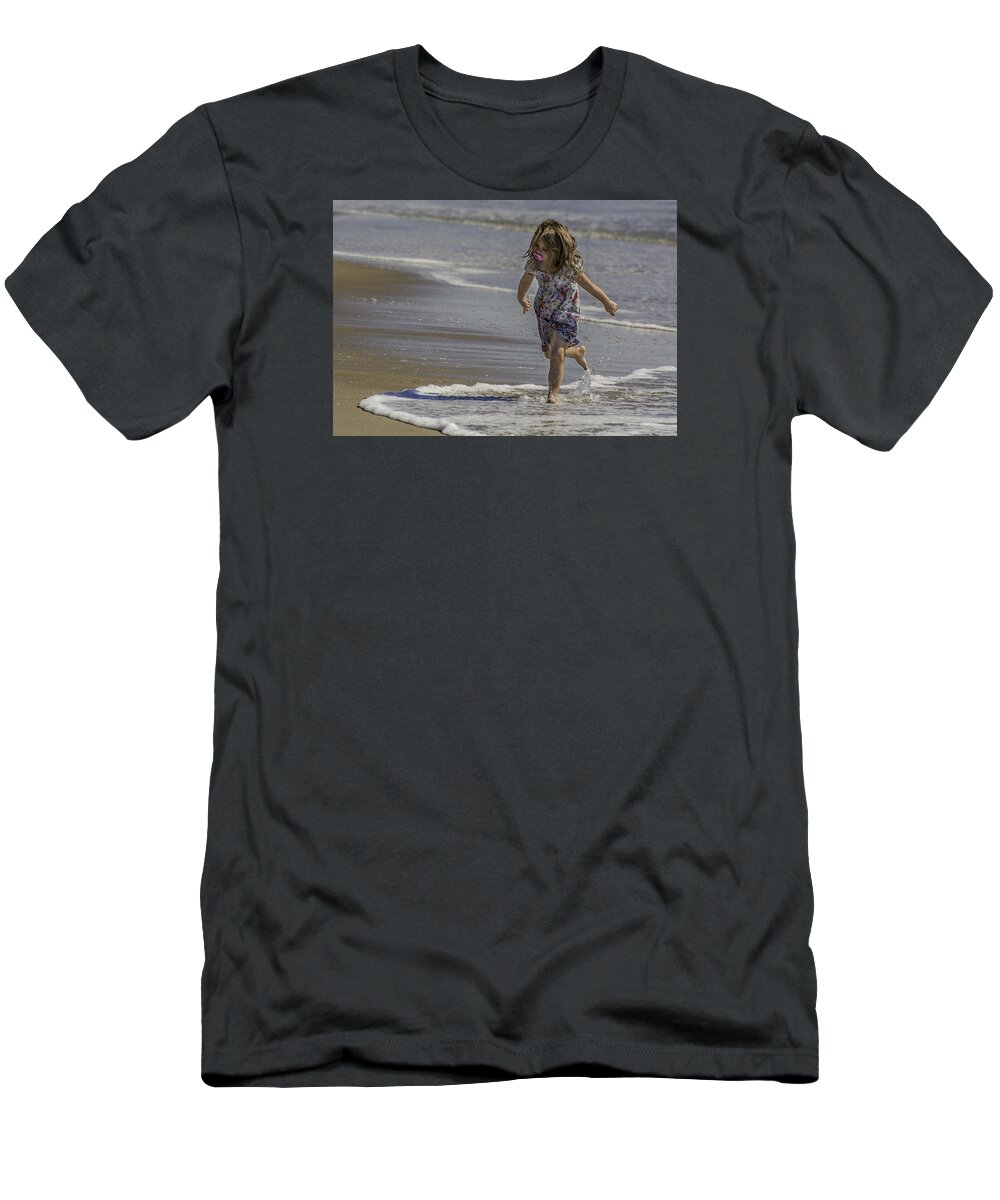 Dancing T-Shirt featuring the photograph Dancing in the surf with a pink pacifier by WAZgriffin Digital