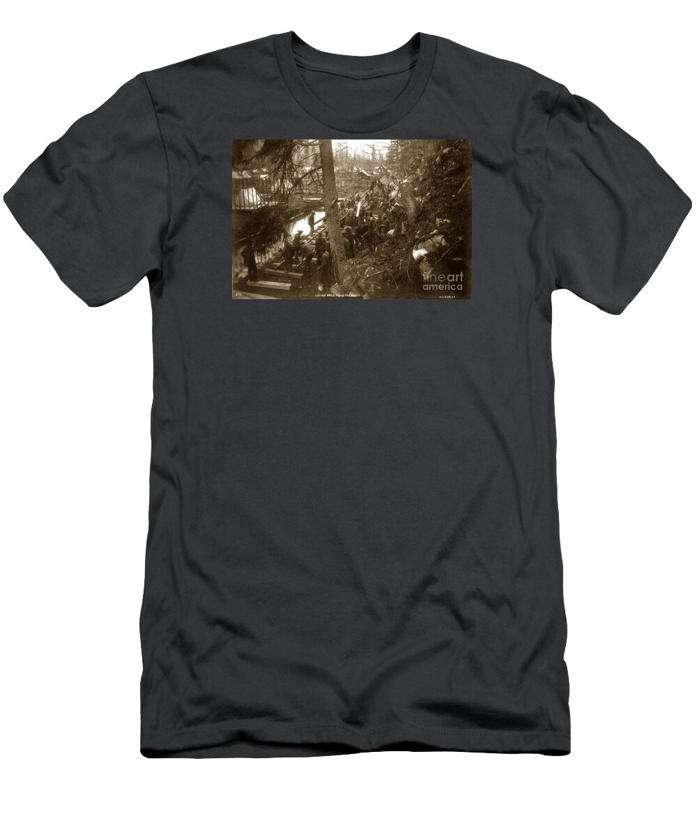 Laying Rails Along The Bluff T-Shirt featuring the photograph Laying rails along the bluff Skagway, Alaska 1898 by Monterey County Historical Society