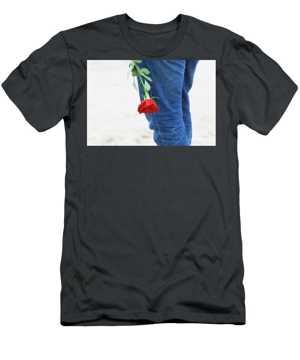Love T-Shirt featuring the photograph Man with a rose behind his back waiting for love. Romantic date on the beach by Michal Bednarek