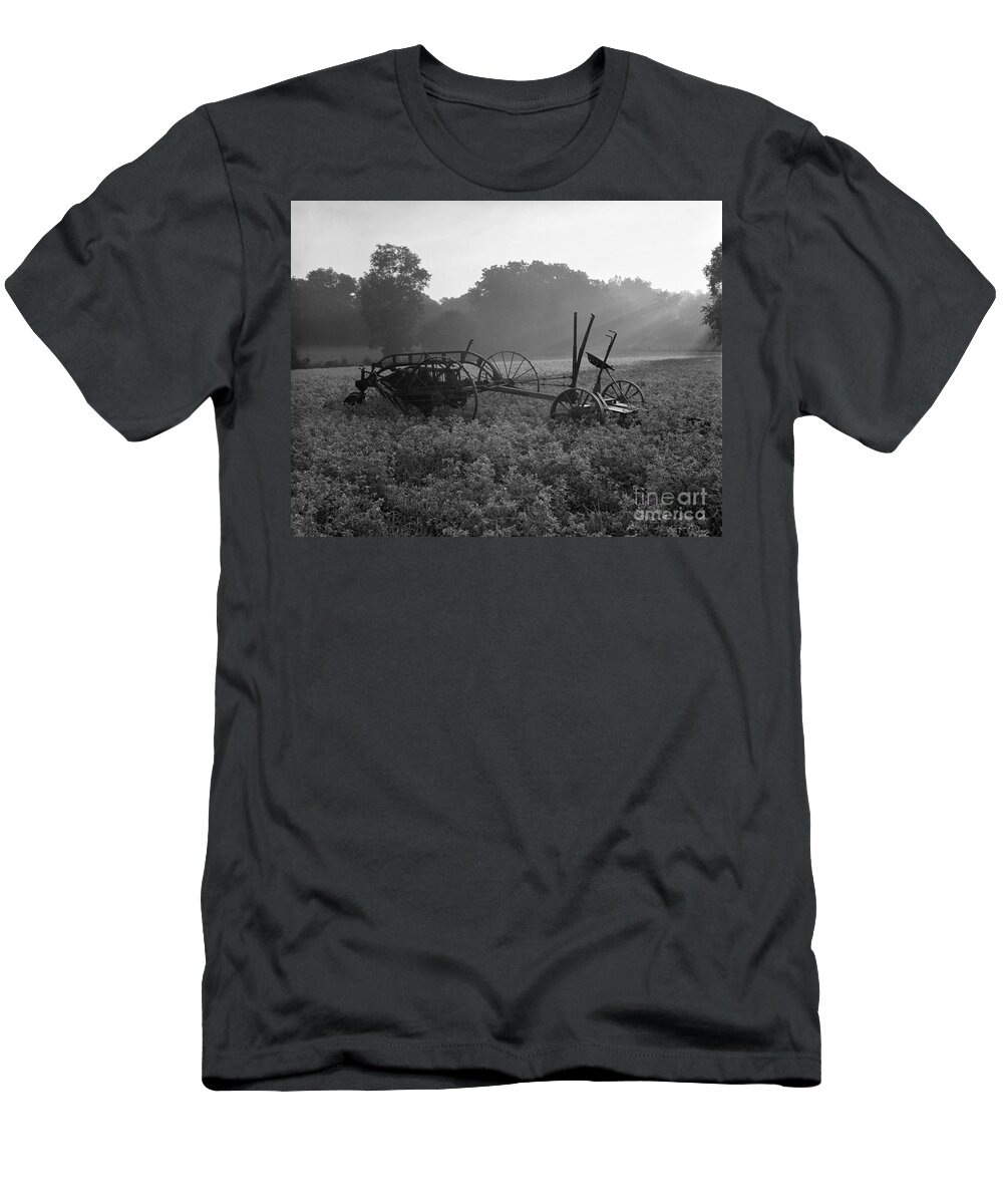 Agriculture T-Shirt featuring the photograph Old Hay Baler In Misty Field by H Armstrong Roberts and ClassicStock