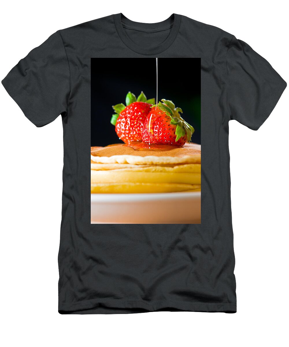 Berries T-Shirt featuring the photograph Strawberry butter pancake with honey maple sirup flowing down by U Schade