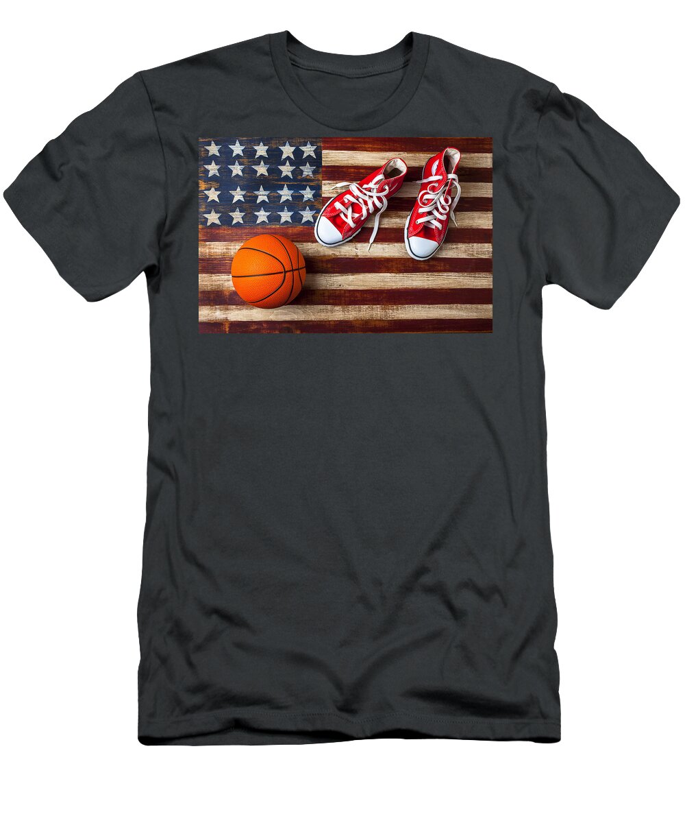 Tennis T-Shirt featuring the photograph Tennis shoes and basketball on flag by Garry Gay