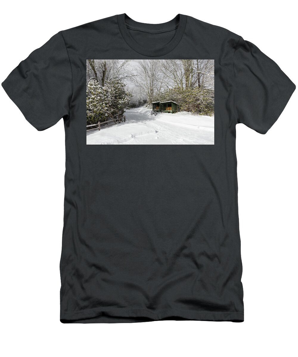 Snow T-Shirt featuring the photograph Wagon Wheels and Firewood by D K Wall