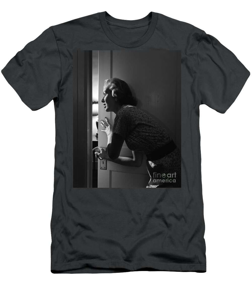 1950s T-Shirt featuring the photograph Woman Peeking Through Door, C.1950s by Debrocke/ClassicStock