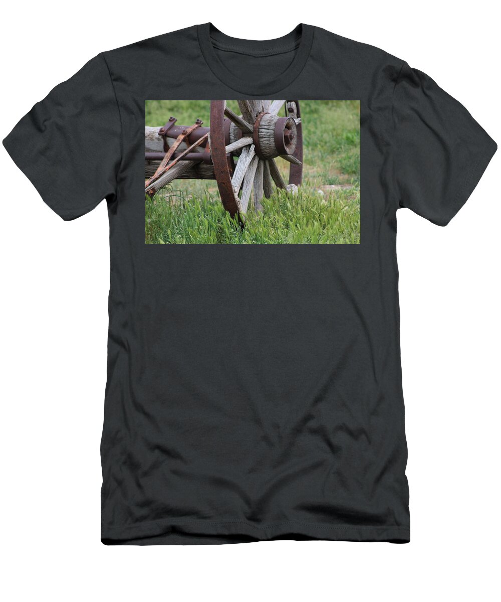 Wagon Wheel T-Shirt featuring the photograph Closeup Vintage Wooden Wagon Wheel in Grass by Colleen Cornelius