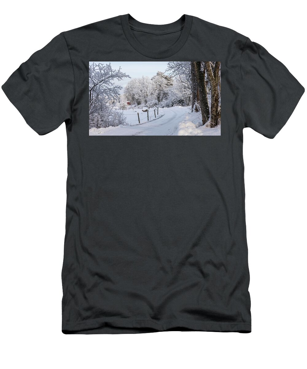 Snowy Gravelled Road T-Shirt featuring the photograph Gravelled road in winter by Torbjorn Swenelius
