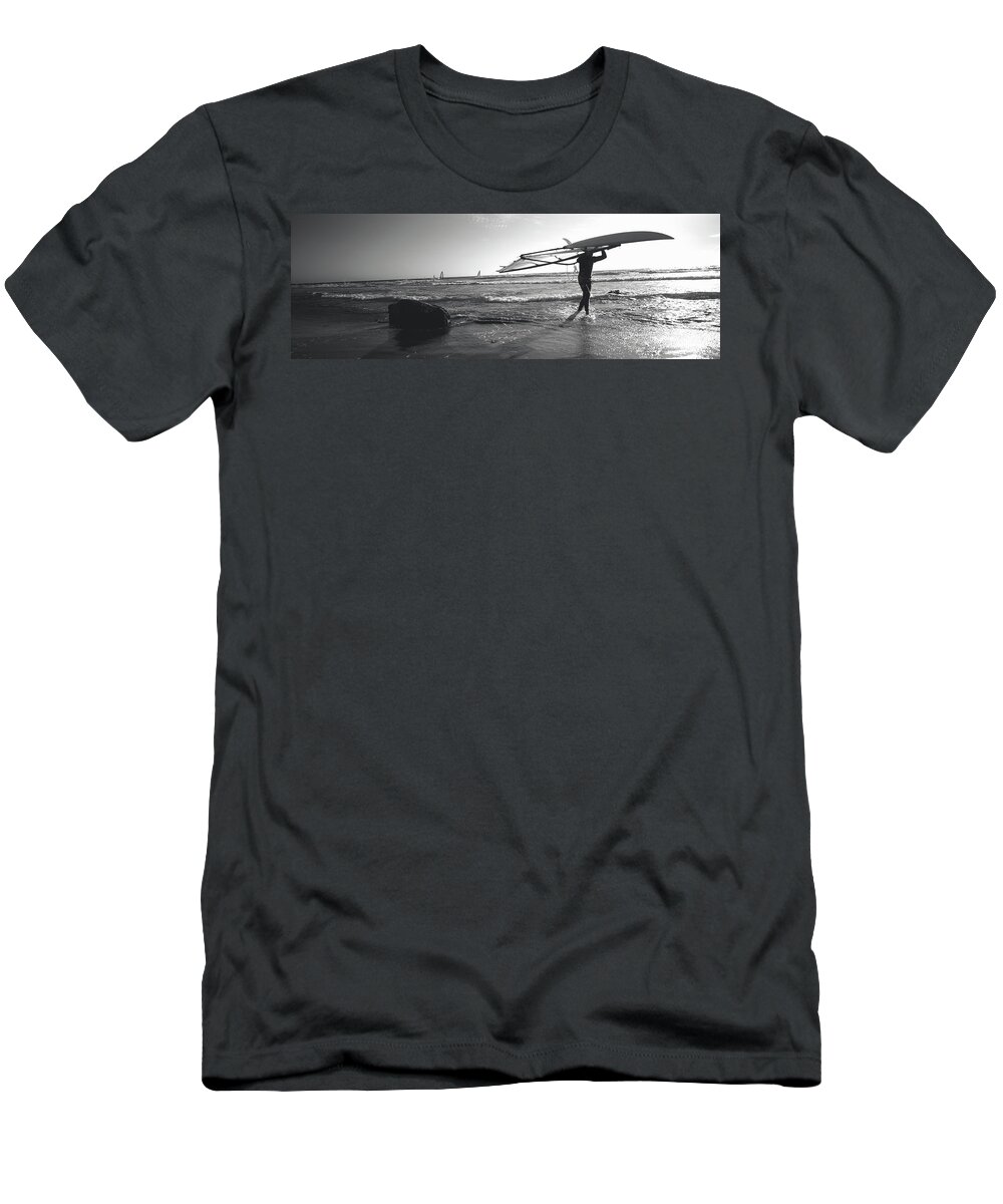 Photography T-Shirt featuring the photograph Man Carrying A Surfboard Over His Head by Panoramic Images