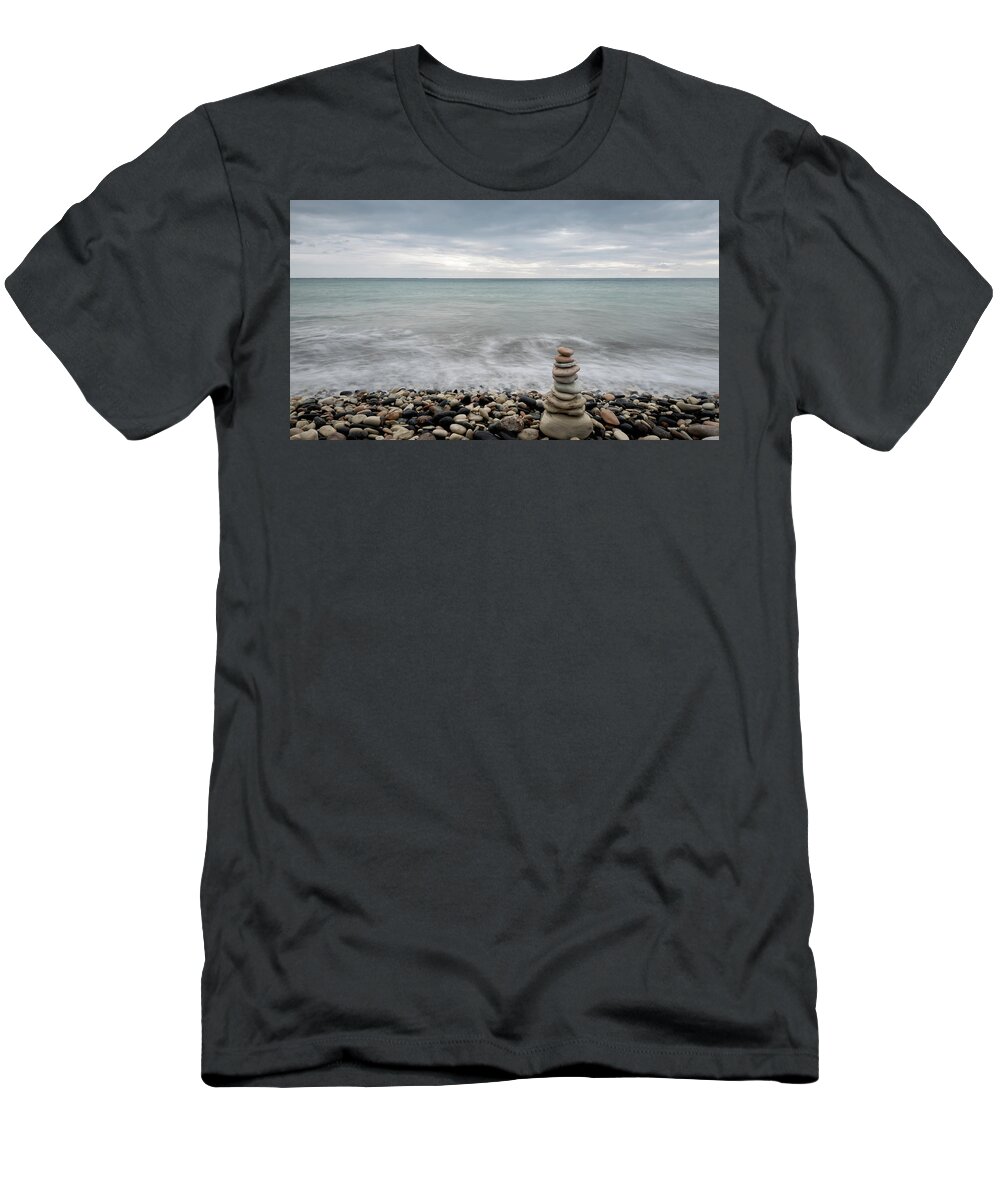 Sea And Ocean T-Shirt featuring the photograph Pyramid of balancing stones , in the wavy ocean by Michalakis Ppalis