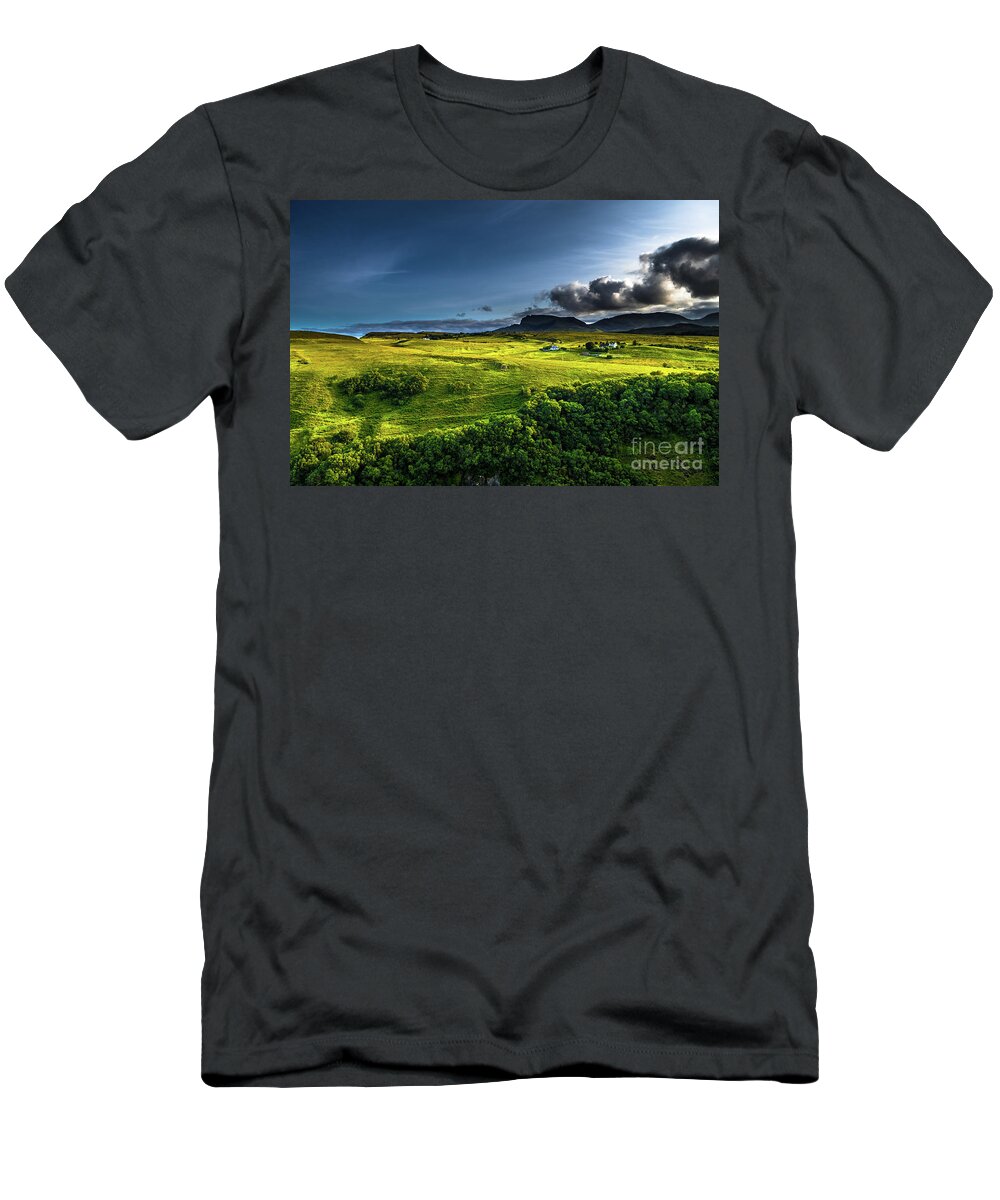 Background T-Shirt featuring the photograph Rural Landscape With Remote Houses At The Old Man Storr Formation On The Isle Of Skye In Scotland by Andreas Berthold