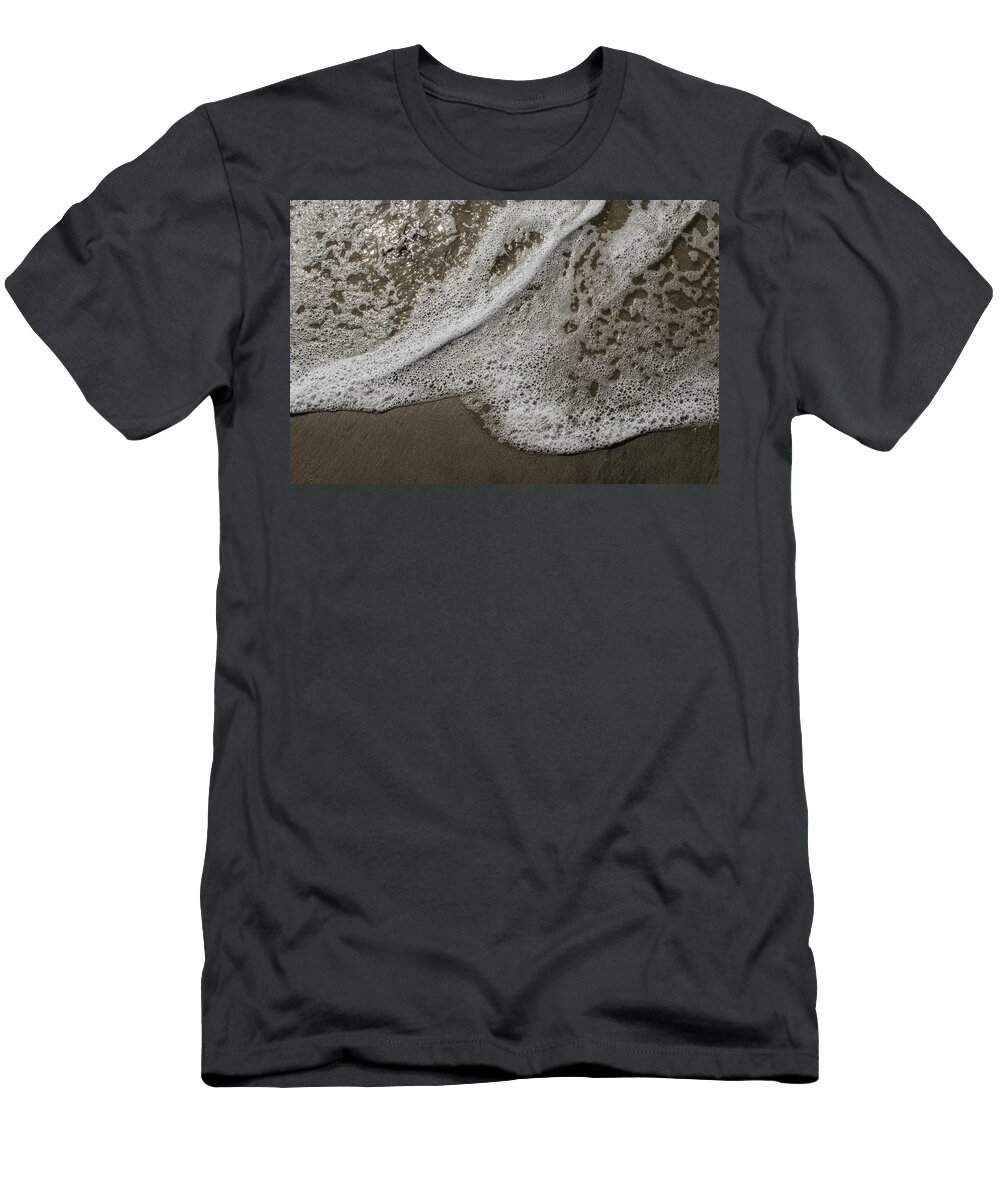 Surf T-Shirt featuring the photograph Surf Foam On The Sand by Alan Goldberg