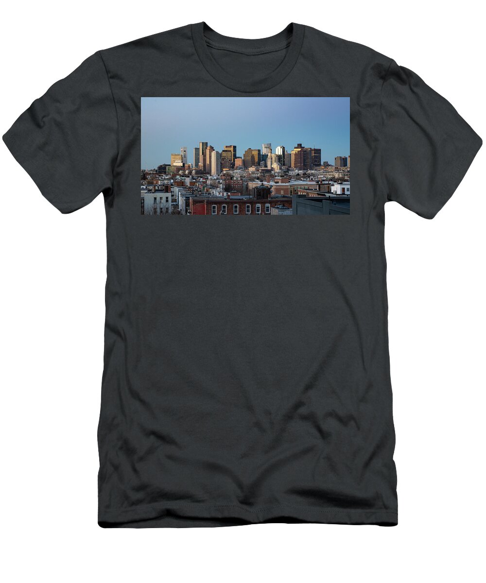 America T-Shirt featuring the photograph The skyline of Boston in Massachusetts, USA on a clear Winter ev by Kyle Lee