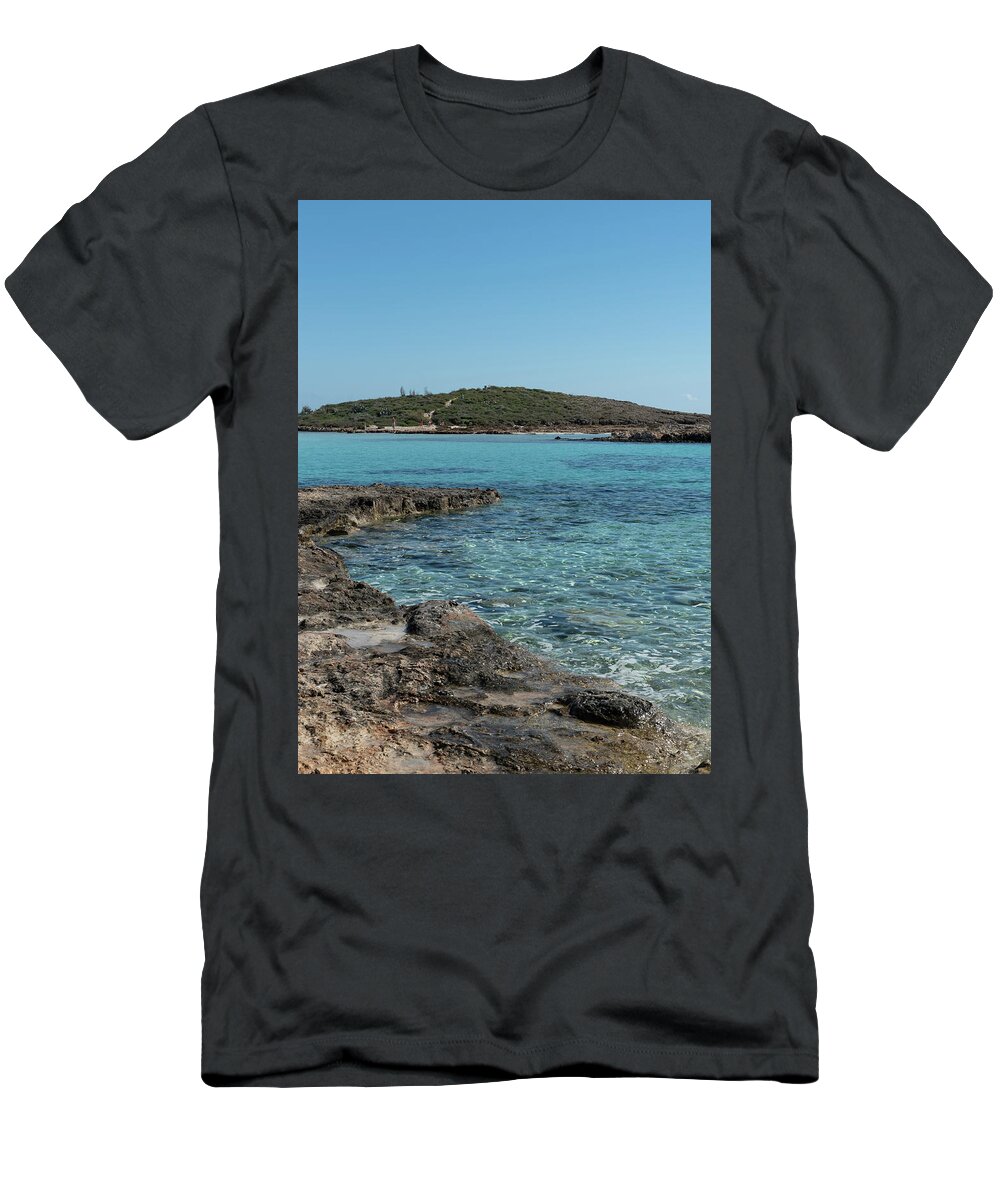 Agia Napa T-Shirt featuring the photograph Empty beach with blue water at Nissi beach ayia napa Cyprus. Famous tourist resort with clean water #2 by Michalakis Ppalis