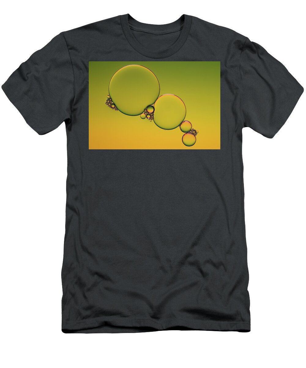 Connection T-Shirt featuring the photograph Bright abstract, yellow background with flying bubbles #3 by Michalakis Ppalis