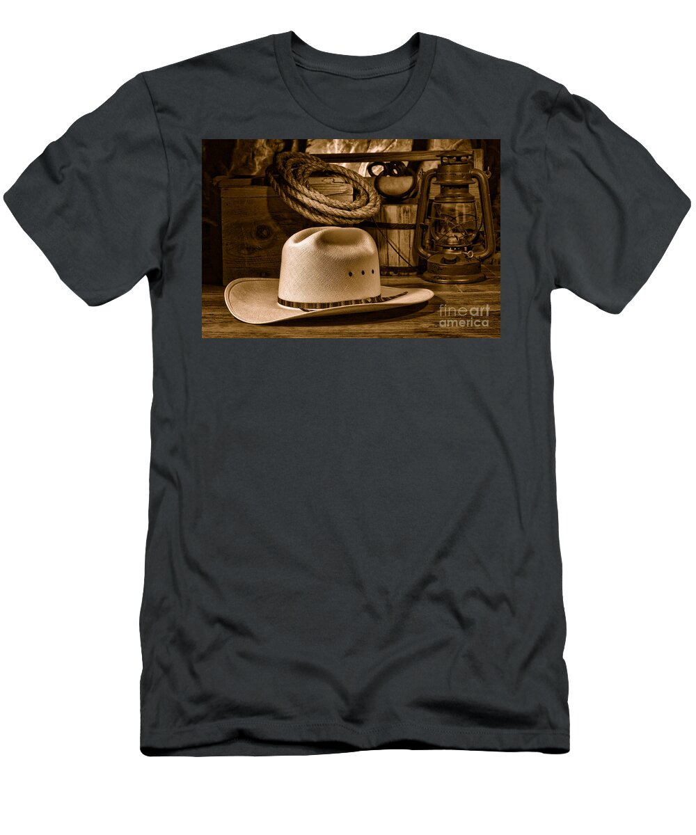 Cowboy T-Shirt featuring the photograph American West Rodeo Cowboy Hat - Sepia by Olivier Le Queinec