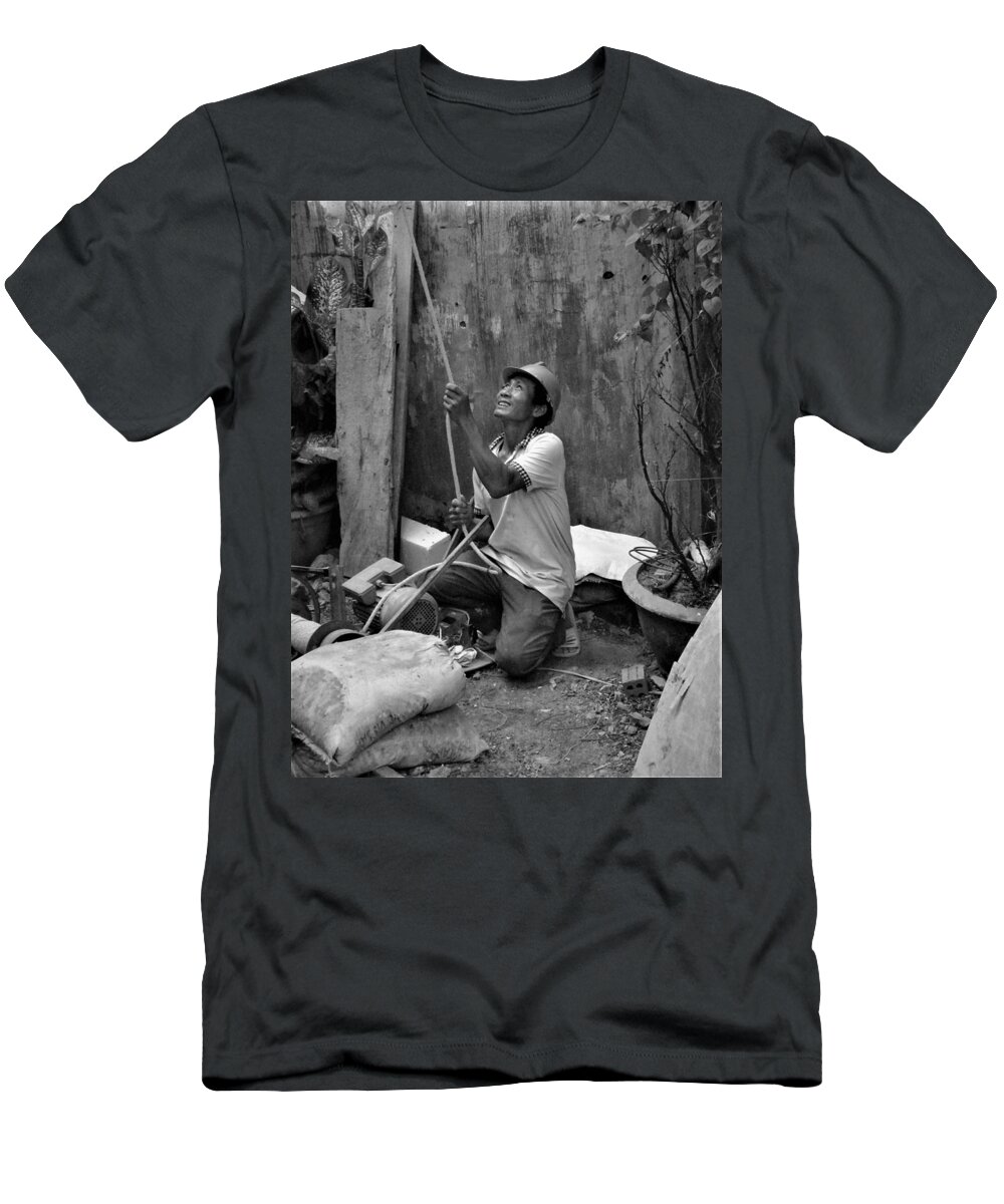 Construction T-Shirt featuring the photograph Construction worker with the rope by Robert Bociaga