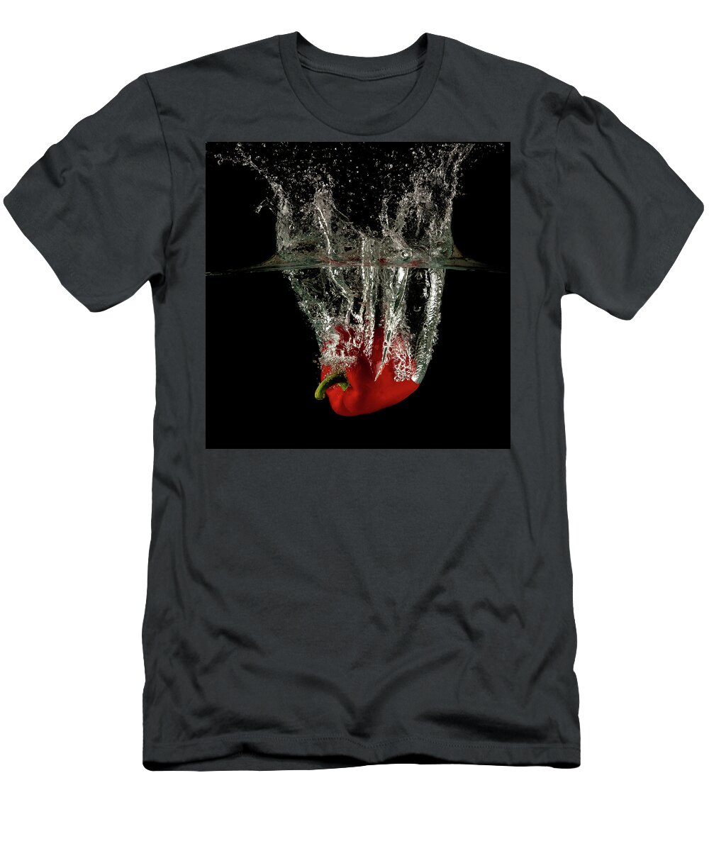 Pepper T-Shirt featuring the photograph Red bell pepper dropped and slashing on water by Michalakis Ppalis