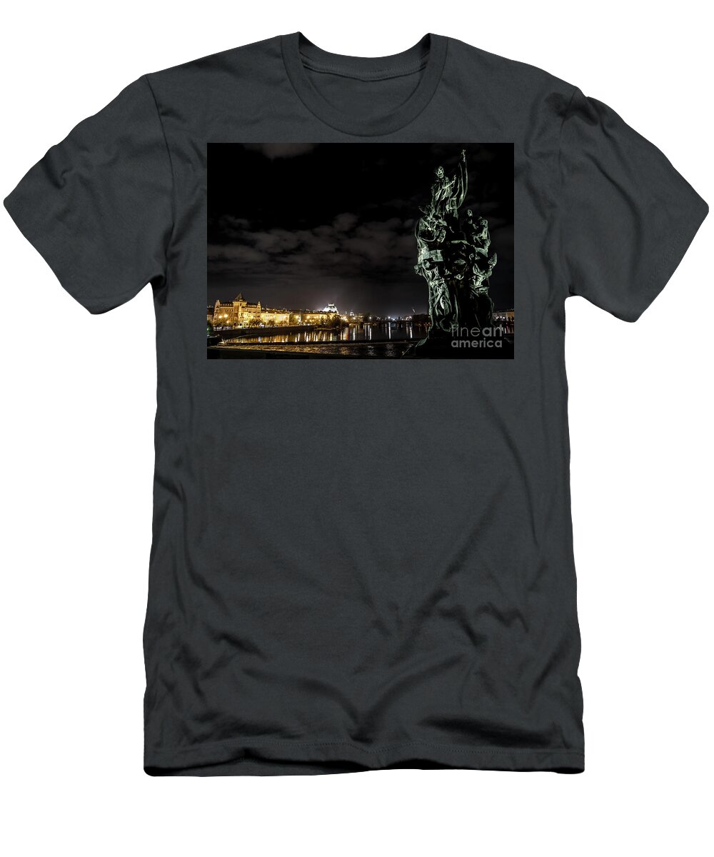 Ancient T-Shirt featuring the photograph Statue On Charles Bridge And Illuminated Buildings In Prague In The Czech Republic by Andreas Berthold