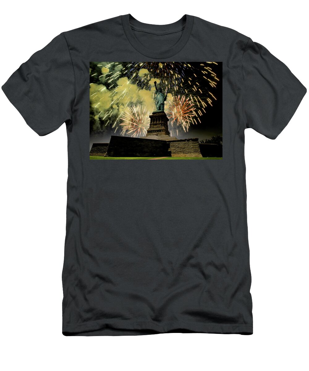 Statue Of Liberty T-Shirt featuring the photograph Statue of Liberty with fire works by Montez Kerr