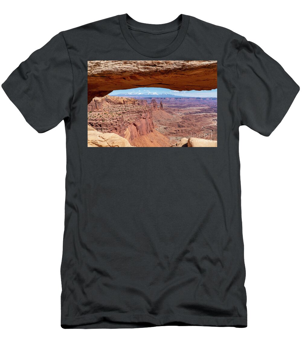 Canyonlands National Park T-Shirt featuring the photograph The Washerwoman Arch is framed by the Mesa Arch at Canyonlands N by William Kuta