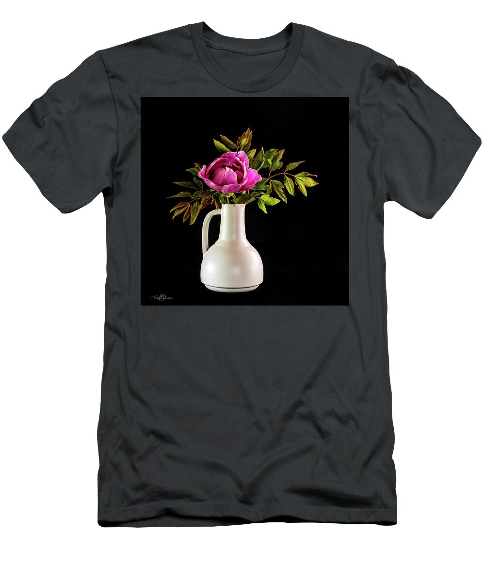 Tree Peony T-Shirt featuring the photograph Tree peony Lan He Paeonia suffruticosa rockii in a white vase on a black background by Torbjorn Swenelius