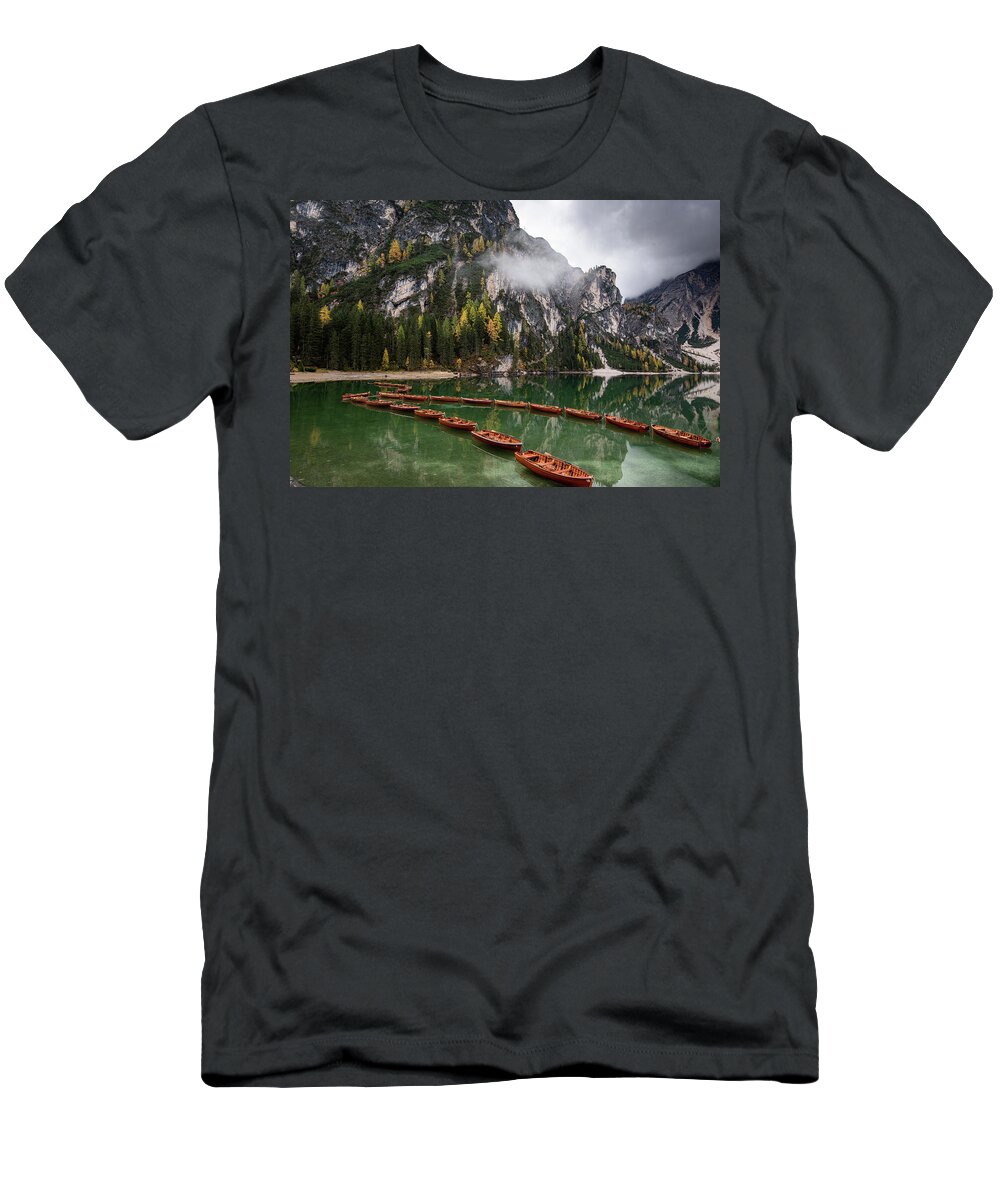 Lago Di Braies T-Shirt featuring the photograph Wooden boats on the peaceful lake. Lago di braies, Italy by Michalakis Ppalis