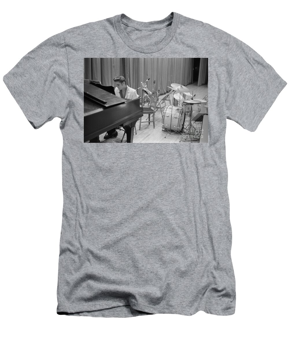 Elvis Presley T-Shirt featuring the photograph Elvis Presley on piano waiting for a show to start 1956 by The Harrington Collection
