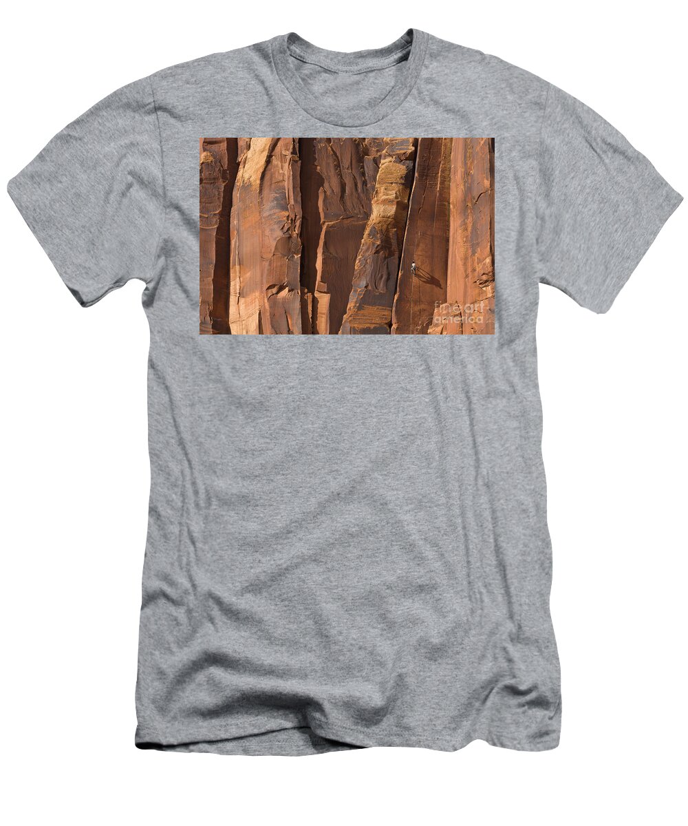 00559216 T-Shirt featuring the photograph Rock Climber Indian Creek Utah by Yva Momatiuk and John Eastcott