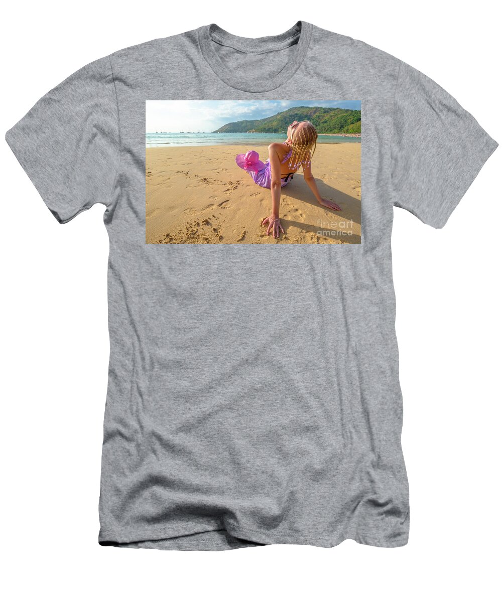 Woman T-Shirt featuring the photograph Beautiful woman sunbathing on beach by Benny Marty