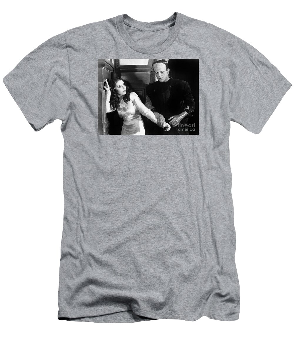 Frankensteins T-Shirt featuring the photograph Frankensteins Monster molests young girl Boris Karloff by Vintage Collectables